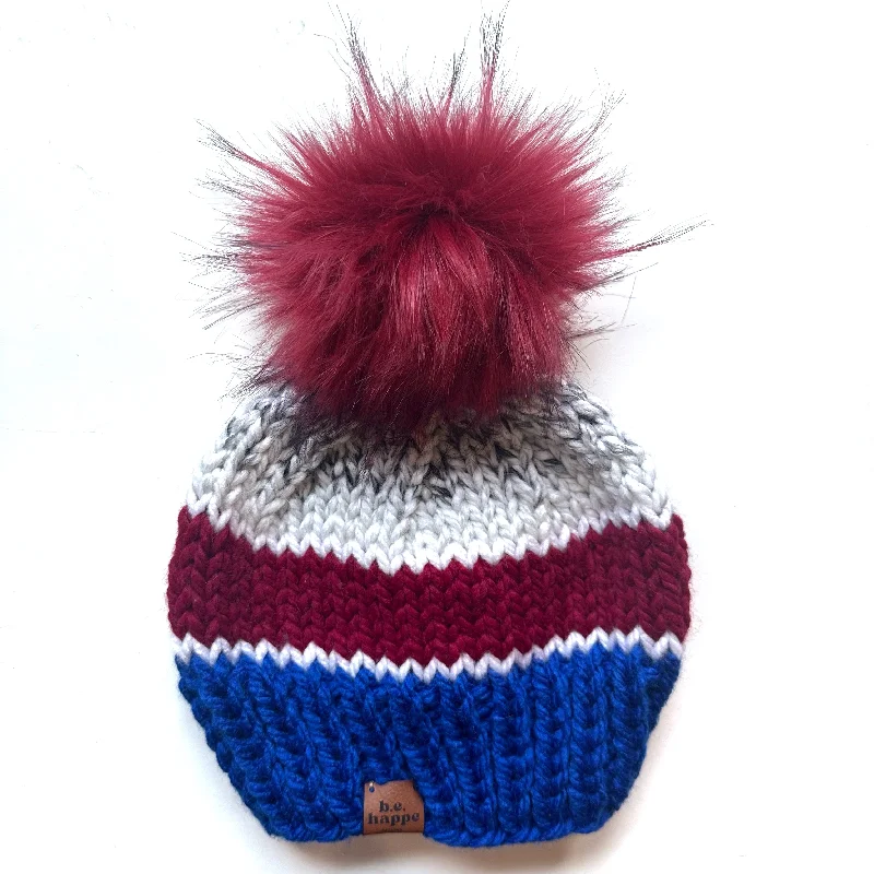 beanies with vibrant colors-  Adult Stripe Knit Pom Hat | Marble +Red + Blue