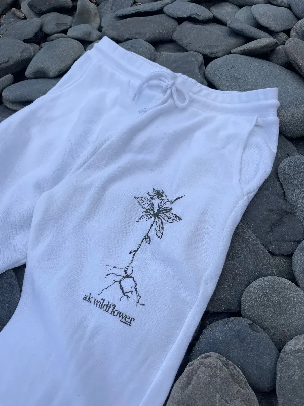 beanies with detailed stitching-  White 50/50 AK Wildflower Joggers. $68.00